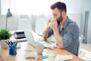 Sick Employee at Desk