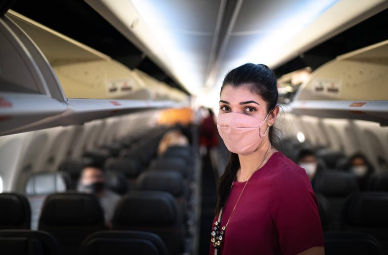 Woman Wearing Face Mask on Airplane