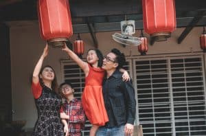 Family Fixing Red Chinese Lanterns