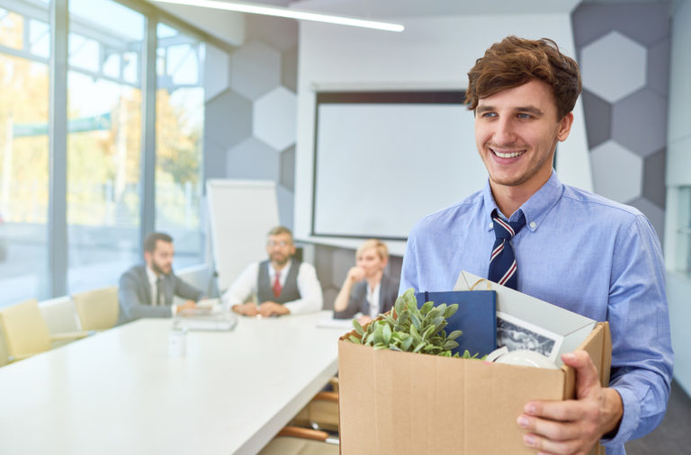 Employee Holding Box of Personal Belongings