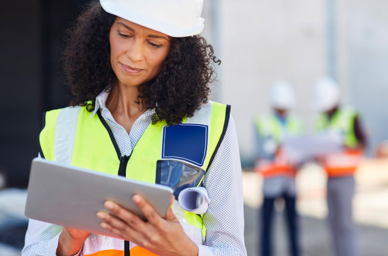 Female Facility Engineer Working Tablet