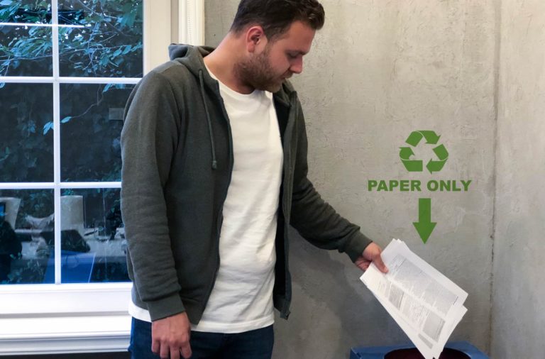 Man Recycling Paper Recycle Bin