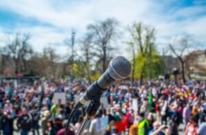 Microphone on Stage Crowd Protesting