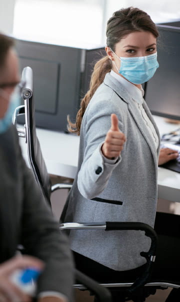 Woman in Mask Giving Thumbs Up