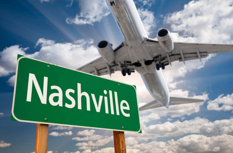 Airplane Above Nashville Road Sign