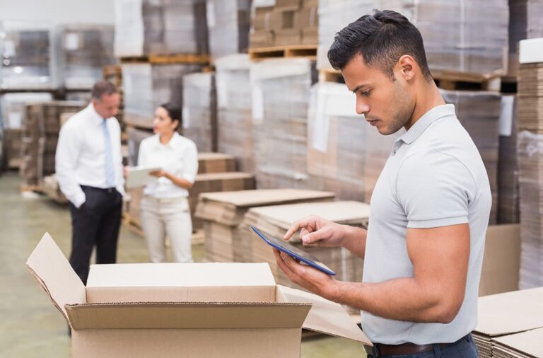 Manager on Digital Tablet in Warehouse