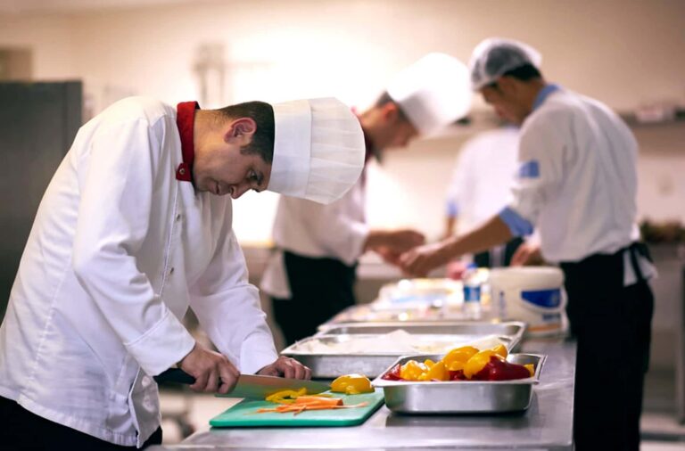 Chef in Kitchen Preparing Food